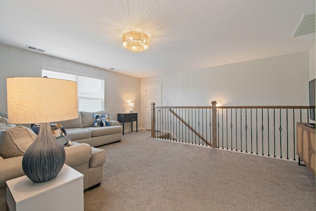 carpeted living area with visible vents