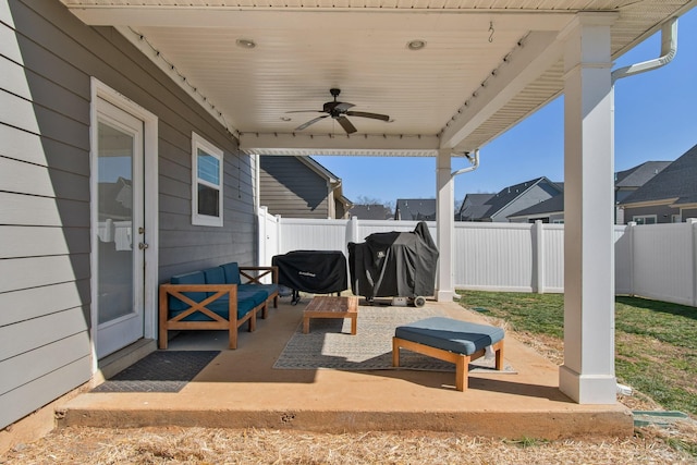 view of patio / terrace with a fenced backyard and a ceiling fan