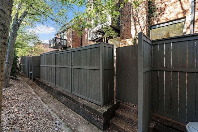 view of gate with fence