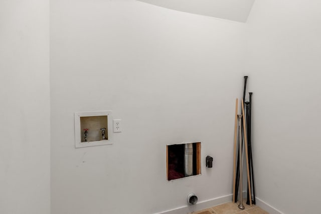 laundry area featuring laundry area, hookup for a washing machine, baseboards, and light tile patterned flooring