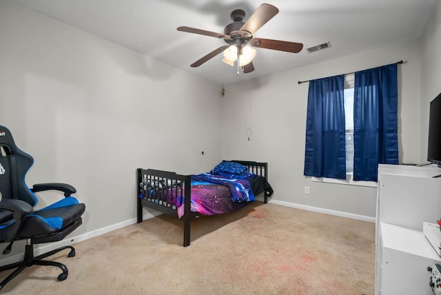 bedroom featuring baseboards, visible vents, and carpet flooring