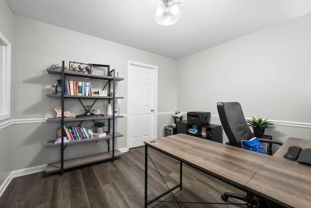 office featuring a textured ceiling, wood finished floors, and baseboards