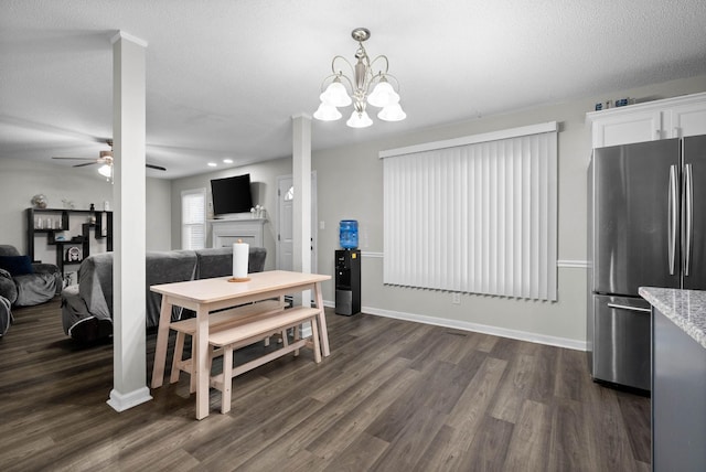 dining room with a fireplace, baseboards, dark wood finished floors, and a ceiling fan