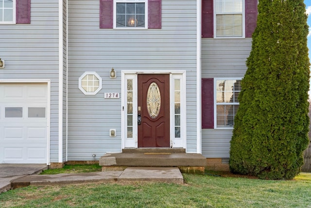 entrance to property with a garage and crawl space