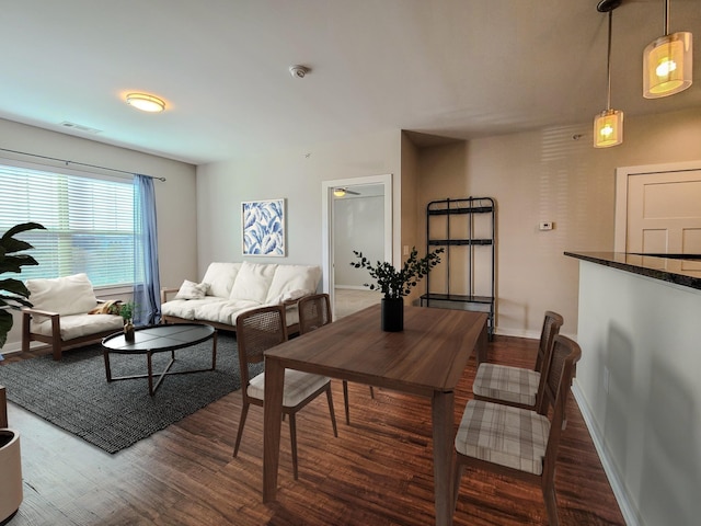 living area with wood finished floors and visible vents