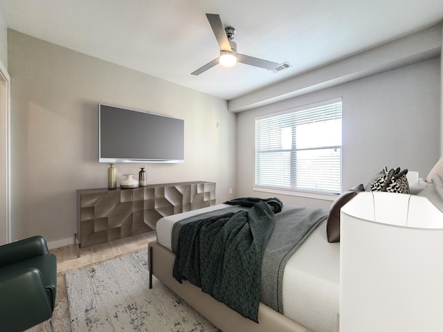 bedroom with baseboards, visible vents, and a ceiling fan