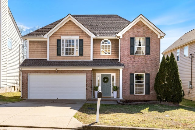 view of front of house with a garage, brick siding, driveway, and a front lawn