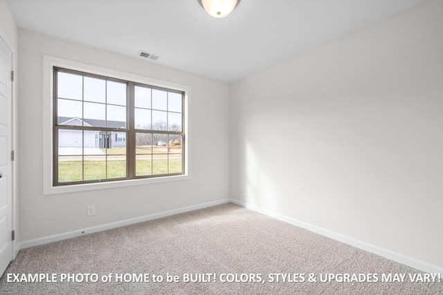 carpeted spare room with visible vents and baseboards