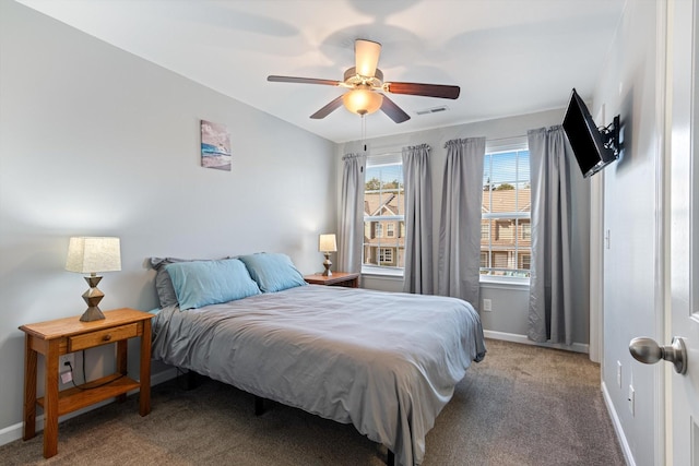 carpeted bedroom featuring visible vents, vaulted ceiling, baseboards, and ceiling fan