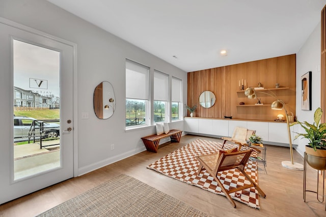 sitting room featuring light wood-style floors and baseboards