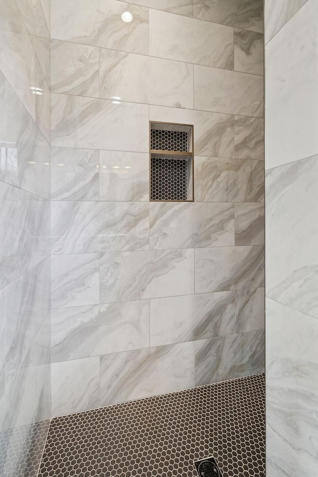 room details with a tile shower