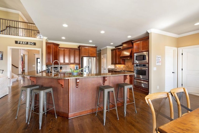 kitchen featuring tasteful backsplash, dark wood-style flooring, stainless steel appliances, a sink, and a warming drawer