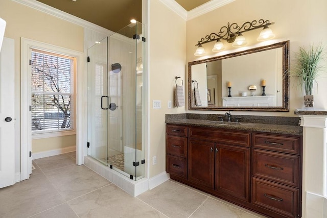 bathroom featuring tile patterned floors, a shower stall, ornamental molding, and vanity