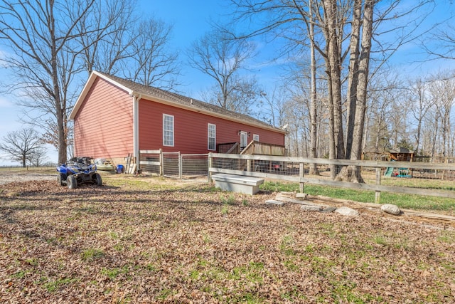 view of side of property with fence