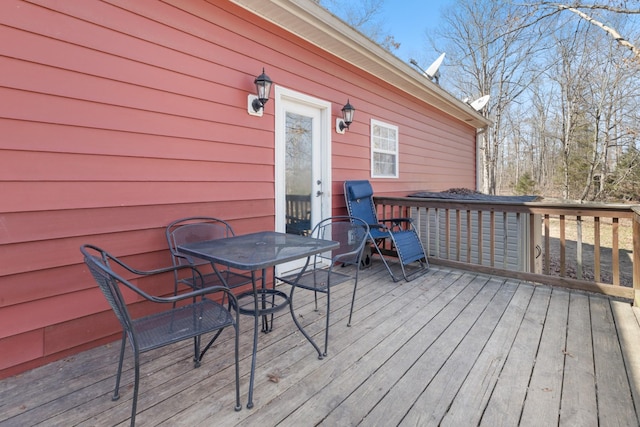 deck featuring outdoor dining area