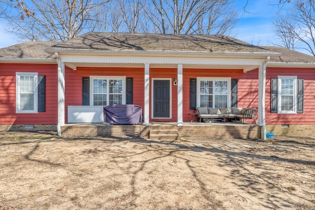 view of front of property featuring a porch, crawl space, and roof with shingles