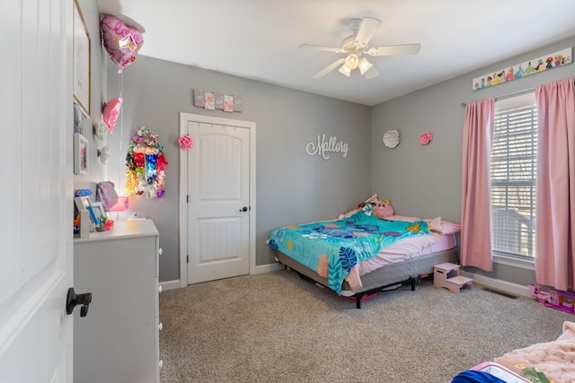 bedroom featuring carpet, a ceiling fan, and baseboards