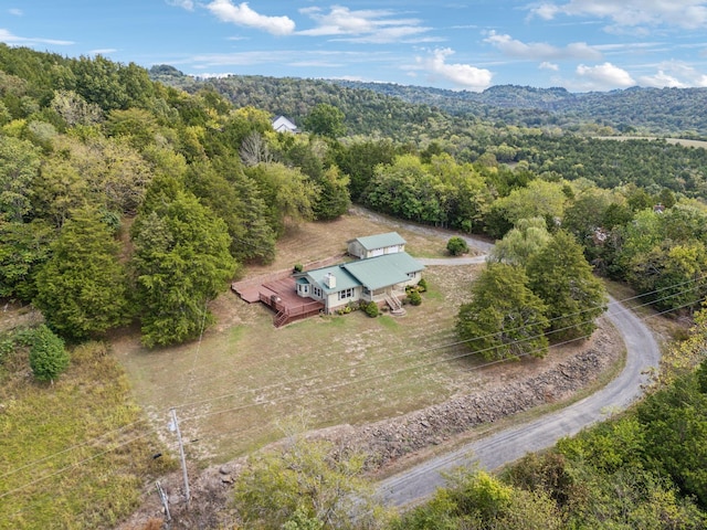 birds eye view of property with a wooded view