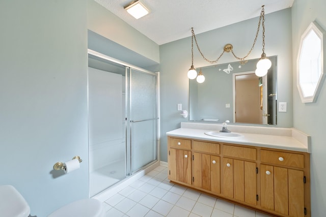 bathroom with a stall shower, toilet, tile patterned floors, vaulted ceiling, and vanity