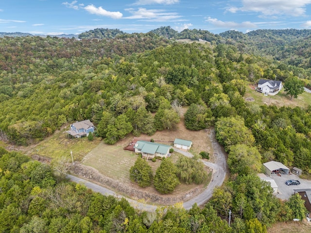 aerial view featuring a wooded view