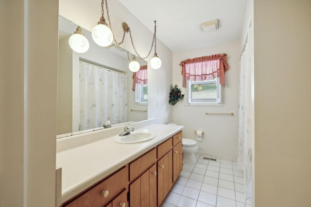 full bath with toilet, visible vents, baseboards, vanity, and tile patterned floors