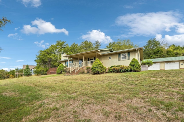 ranch-style house featuring a garage, a porch, and a front yard