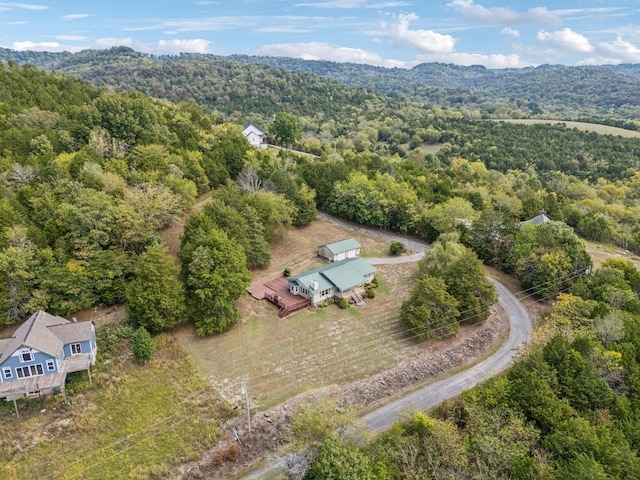 birds eye view of property with a view of trees