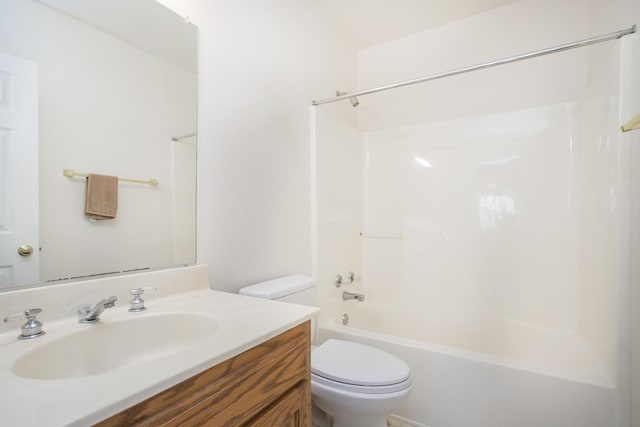 bathroom featuring vanity, toilet, and bathing tub / shower combination