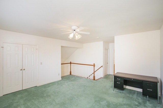 interior space with carpet and ceiling fan