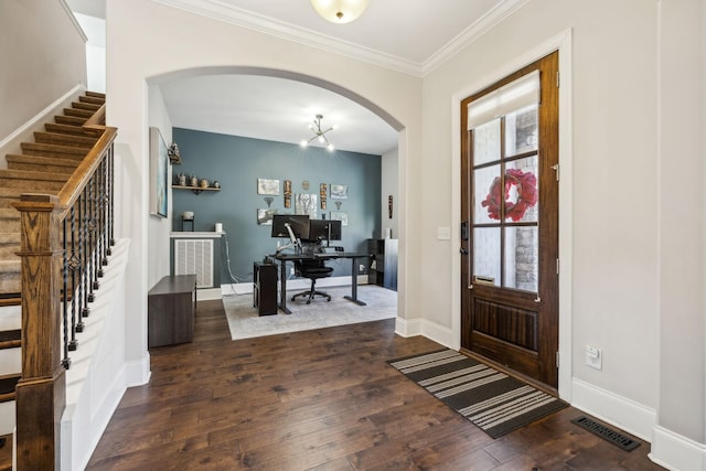 entrance foyer with dark wood-style flooring, visible vents, crown molding, and baseboards