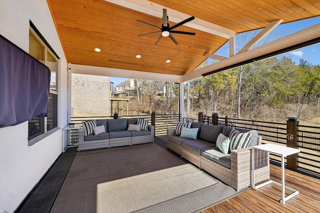 wooden terrace with ceiling fan and outdoor lounge area