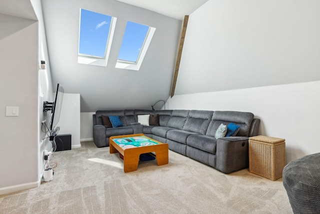 living area featuring lofted ceiling with skylight, baseboards, and carpet flooring