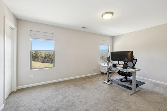 carpeted home office with baseboards and visible vents