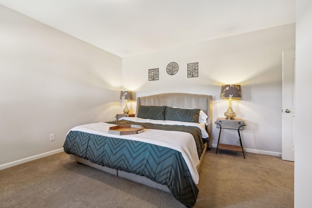 bedroom featuring carpet and baseboards