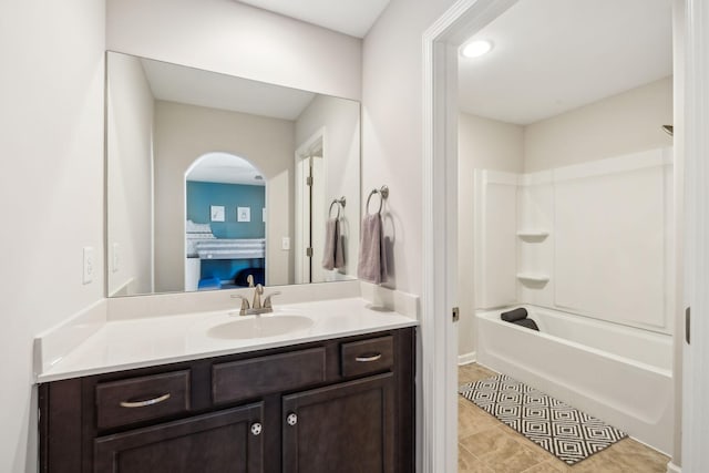 bathroom with  shower combination, vanity, and tile patterned floors