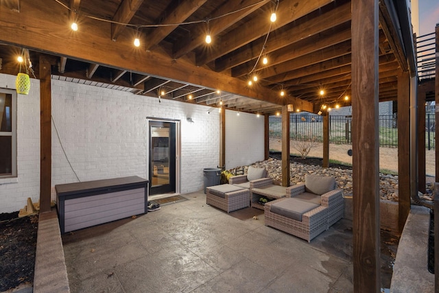 view of patio with an outdoor living space and fence