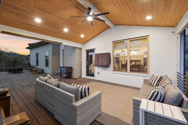 deck with an outdoor hangout area and a ceiling fan