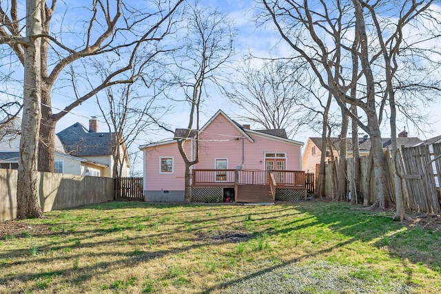 view of yard featuring a fenced backyard and a deck