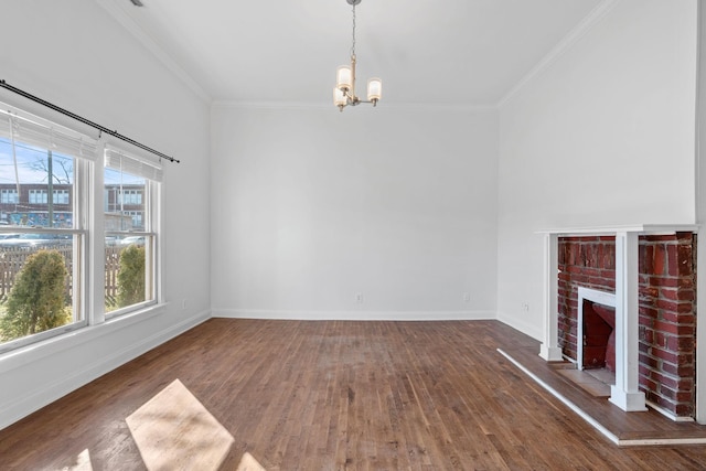 unfurnished living room with ornamental molding, a fireplace, wood finished floors, and baseboards