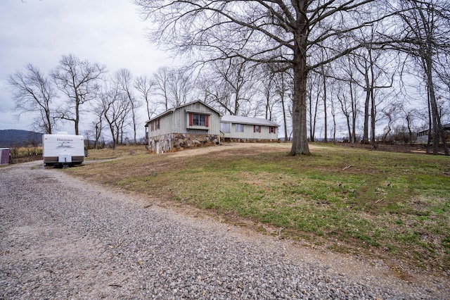 exterior space with gravel driveway