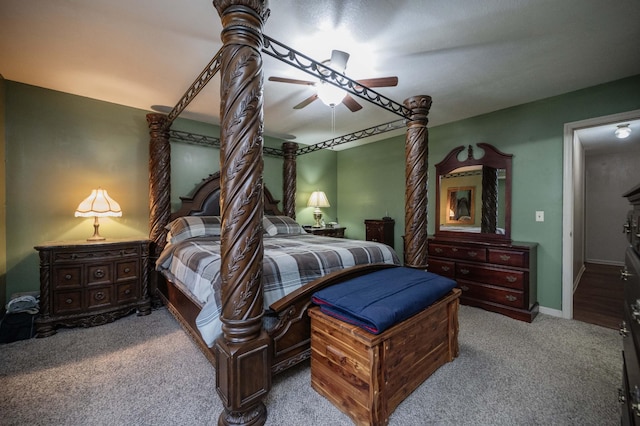 carpeted bedroom with baseboards and a ceiling fan