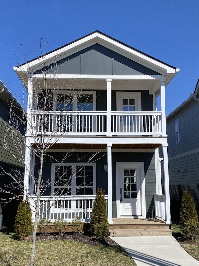 view of front facade featuring covered porch and a balcony