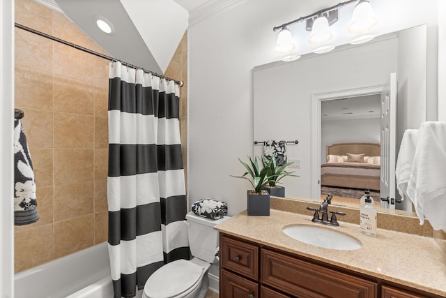 ensuite bathroom with shower / tub combo with curtain, vanity, toilet, and ensuite bathroom