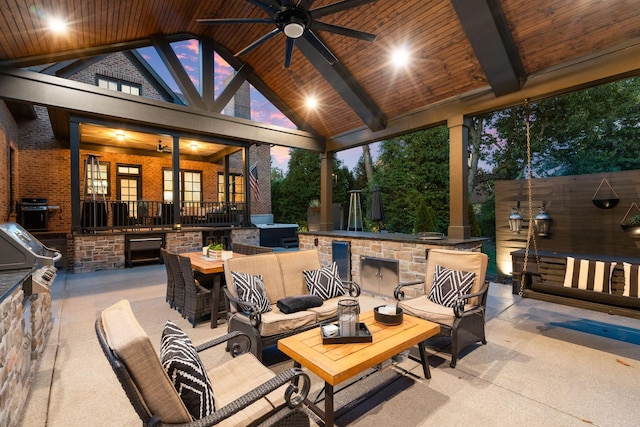 view of patio featuring ceiling fan, an outdoor living space, exterior kitchen, and outdoor wet bar