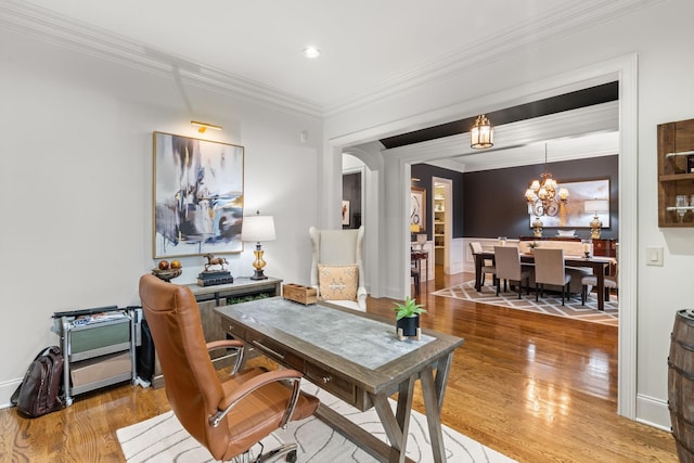 office area featuring baseboards, wood finished floors, crown molding, a notable chandelier, and recessed lighting