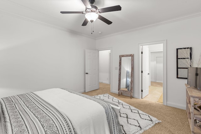 bedroom with a ceiling fan, baseboards, ornamental molding, and carpet flooring