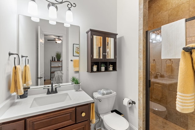 ensuite bathroom featuring a stall shower, toilet, vanity, and ensuite bath