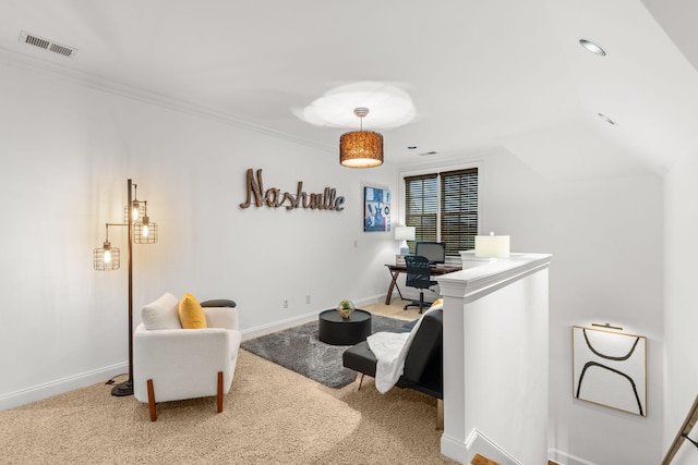 sitting room with ornamental molding, carpet flooring, visible vents, and baseboards