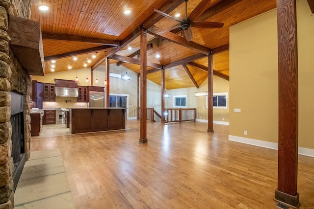 unfurnished living room with light wood-style flooring, ceiling fan, a stone fireplace, wooden ceiling, and baseboards