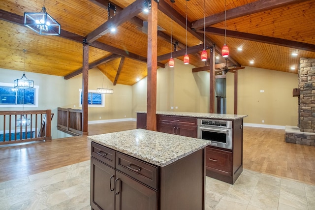 kitchen with a center island, wooden ceiling, stainless steel oven, and open floor plan